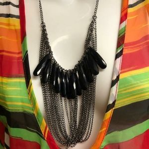 Long double fringed necklace.